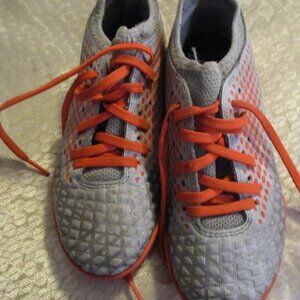 puma soft cleets sz 2 kids orange and gray